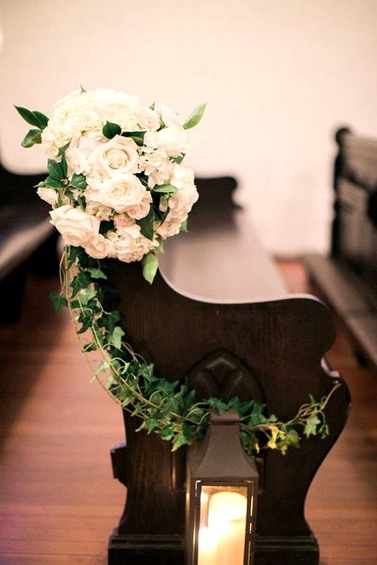 Elegant flower and candle decorated church pew wedding ideas