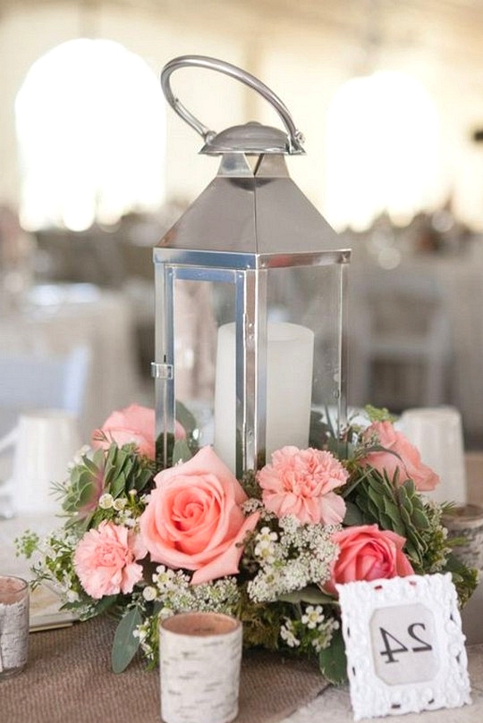 Pink summer wedding centerpiece with lantern and candle