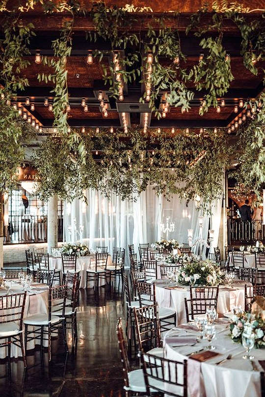 gorgeous wedding reception decorations with lights and floral ceiling