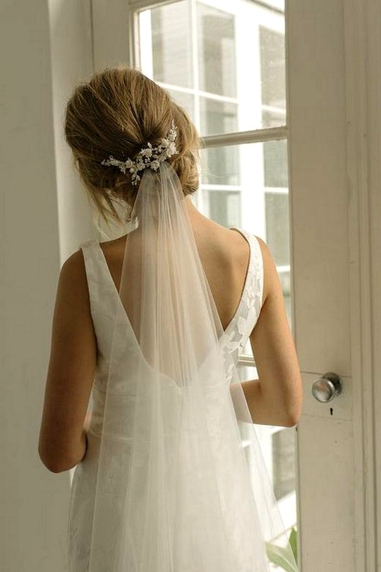 updo wedding hairstyle with veils and accessories