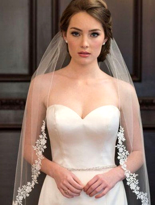 elegant updo wedding hairstyle with lace veil