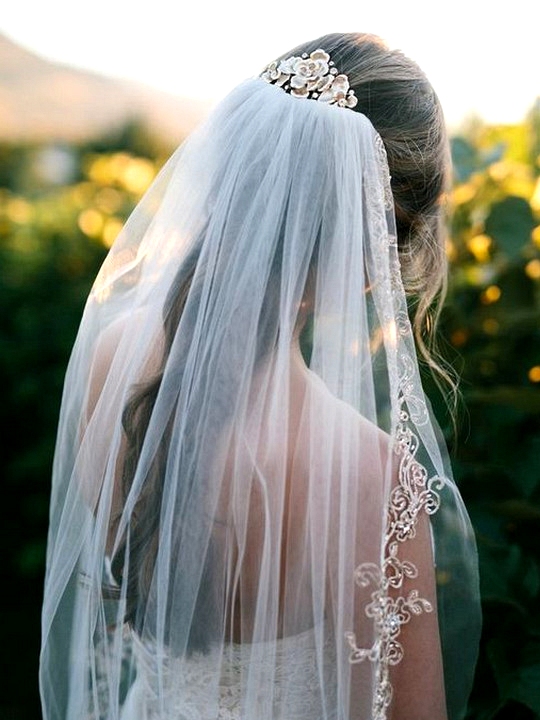 long wedding hairstlye with beaded veil
