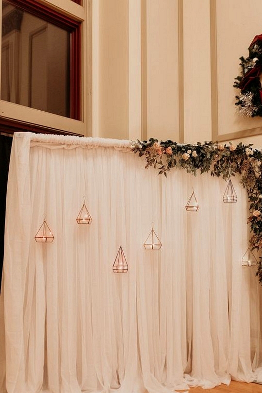 wedding backdrop ideas with rose gold terrariums