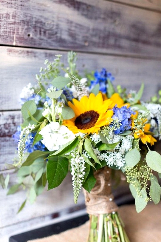 sunflowers blue hydrangea and eucalyptus wedding bouquet