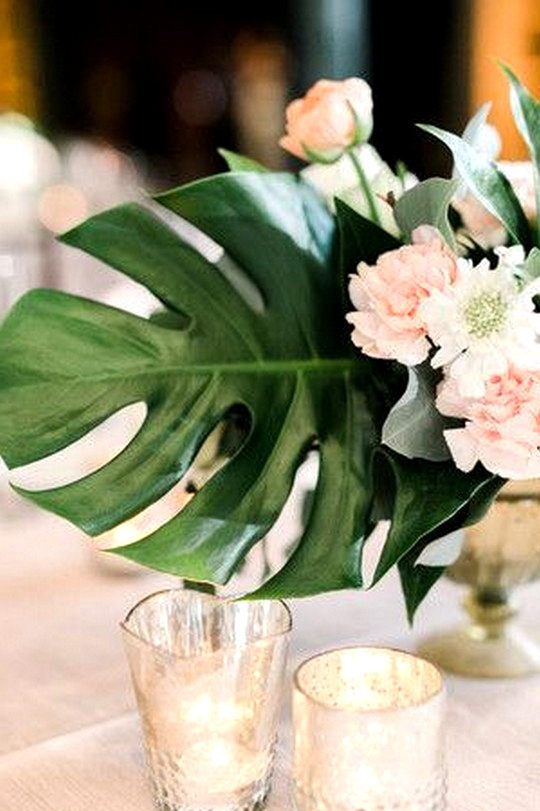 tropical wedding centerpiece with pink floral