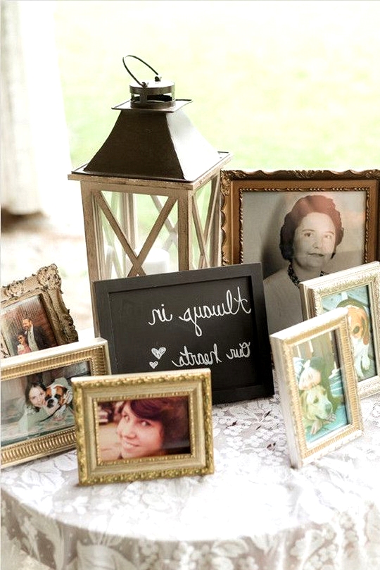 wedding memorial table with photos to honor loved ones