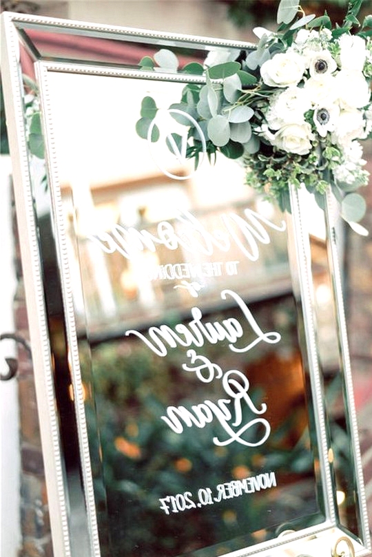 eleagnt mirror and greenery wedding welcome sign