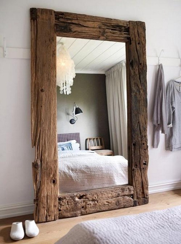Add rustic mirror on the bedroom wall 