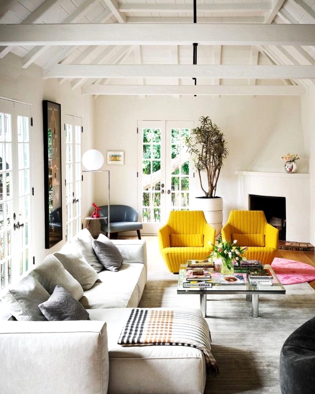 artsy and fun living room decorating idea with yellow armchairs