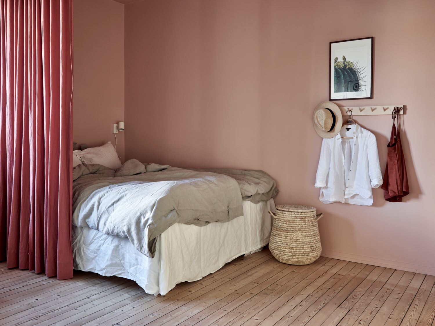 Pink bedroom behind a curtain